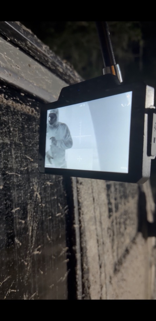 A thermal display mounted inside a mud-splattered vehicle